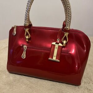Glossy Red Women's Handbag -
Watch >
Premium Convertible Crossbod...